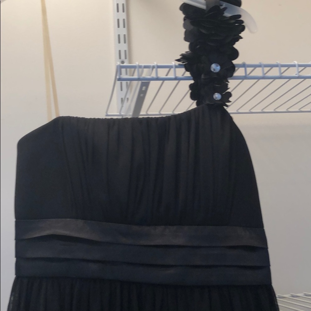 One shoulder, black cocktail dress.